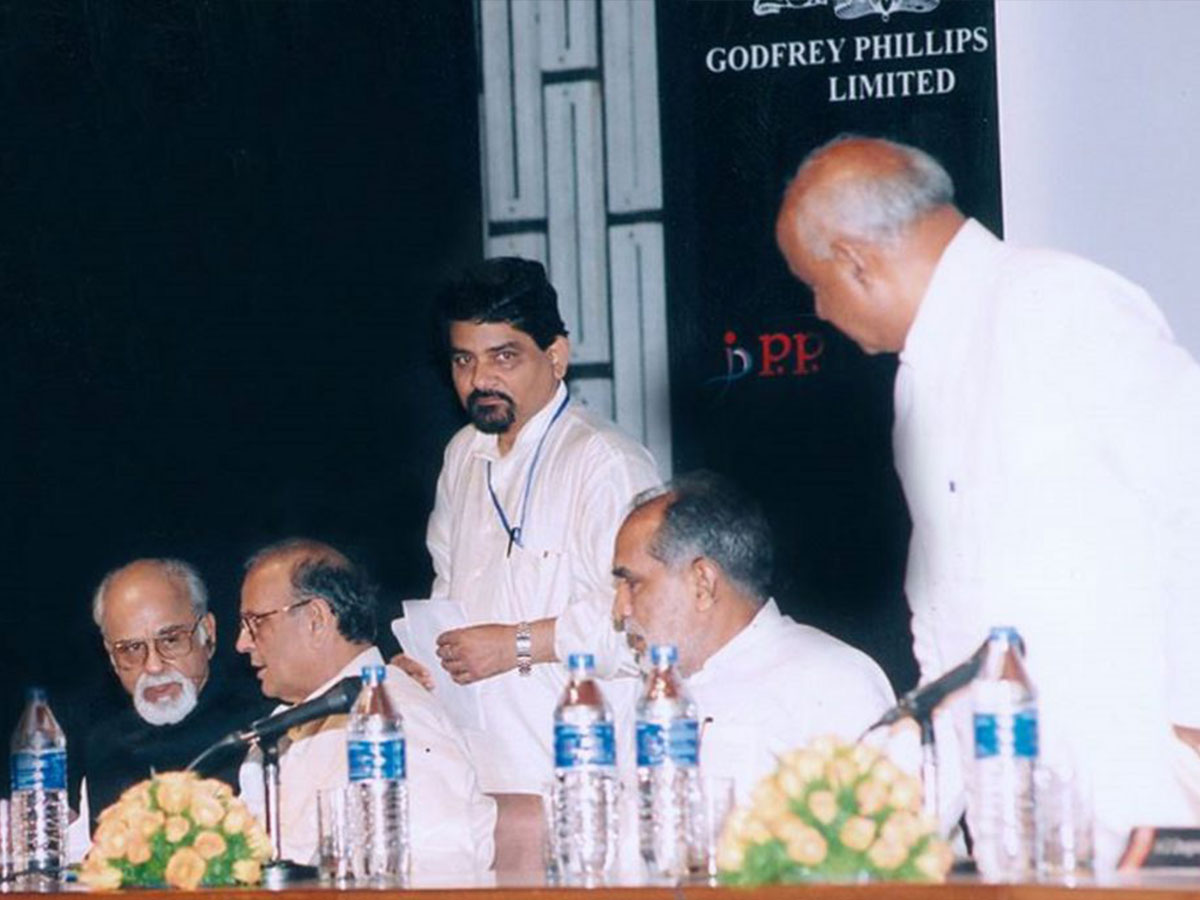Journalist Santosh Bhartiya attending an event with former Prime Minister I. K. Gujral.